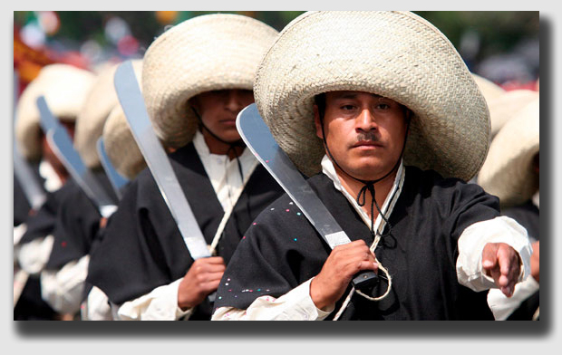 No, this is not Mr. Rush on his way to hack down those extra trees. Rather, it is a Conco de Mayo celebrant in a period costume. Think of him as a Mexican version of a Civil War re-enactor.